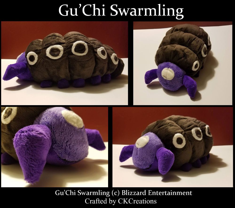 A plushie of a brown and purple grub.
