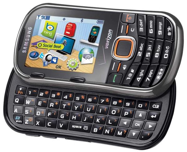 a black 2000s cellphone with a slide-out keyboard