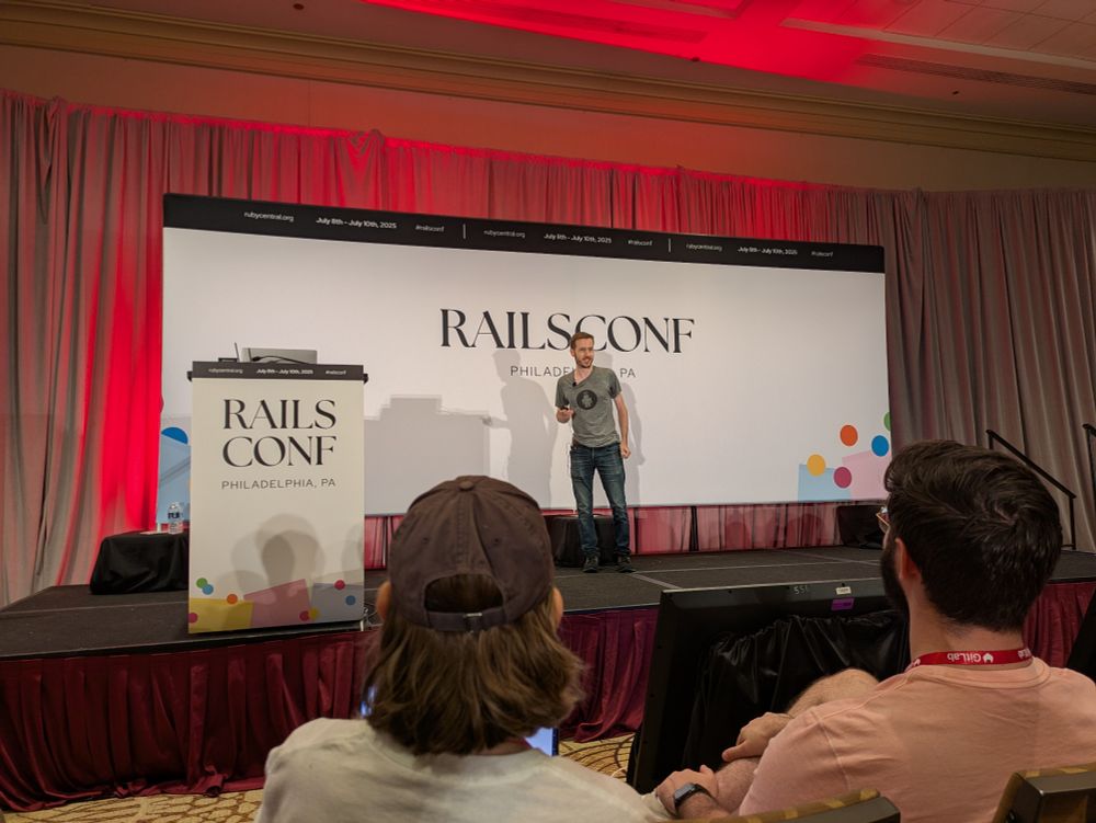 Joël Quenneville on stage at RailsConf