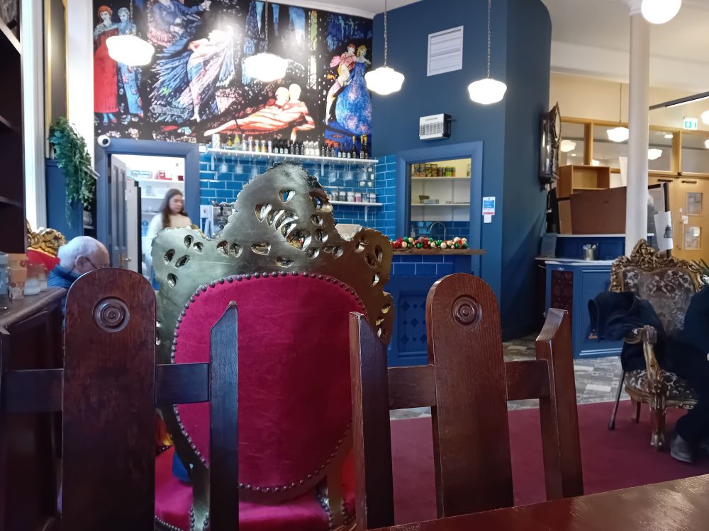 Linen Hall Library café in Belfast. Chairs look like red and gold thrones.