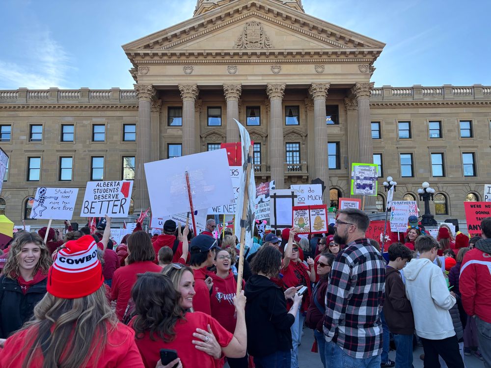 Protestors wear red in support of public education at Alberta’s legislature 