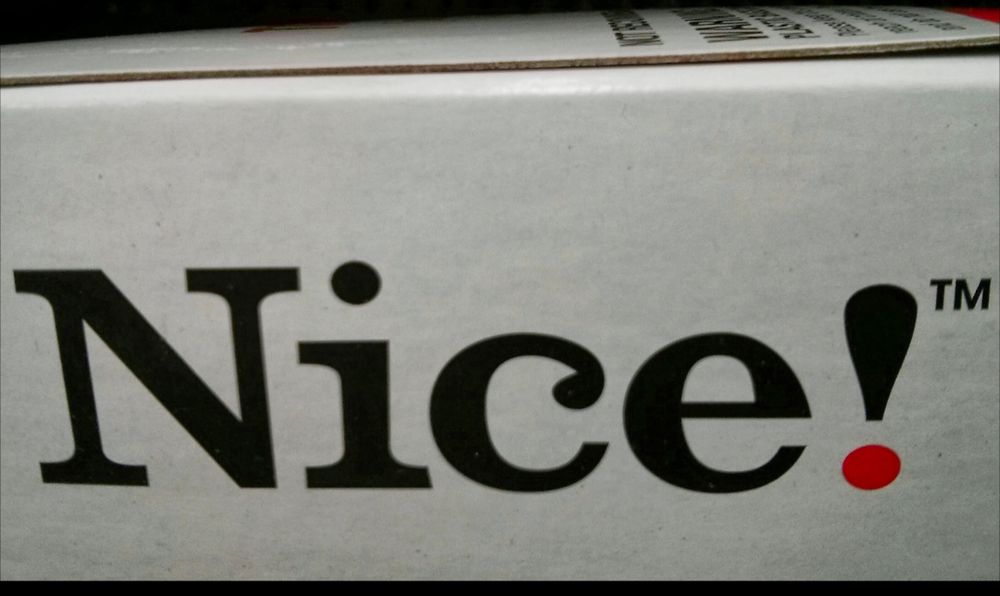 Product logo with the word "Nice!" printed on cardboard.
