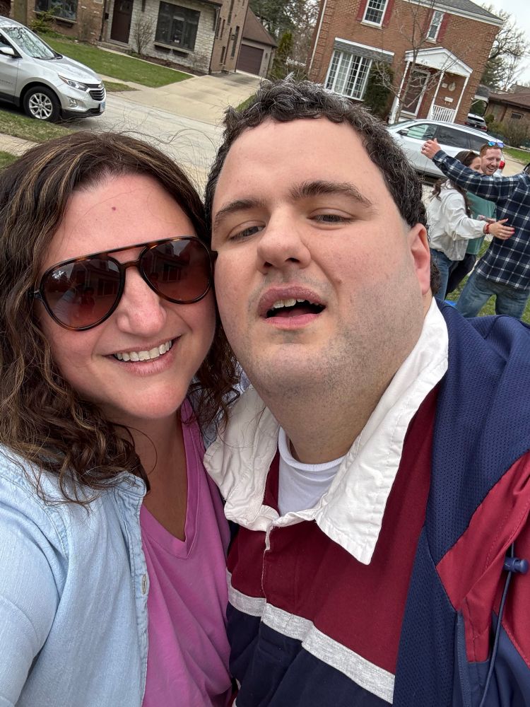 Selfie of two white people smiling 