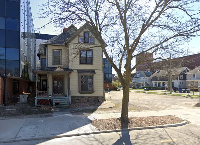 Street view of the historic student homes of Arthur Miller and Katherine Pearson, with ISR looming to the left