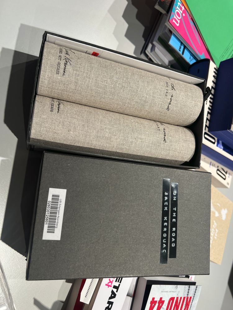 The picture shows an edition of Jack Kerouac's "On the road" as scrolls
