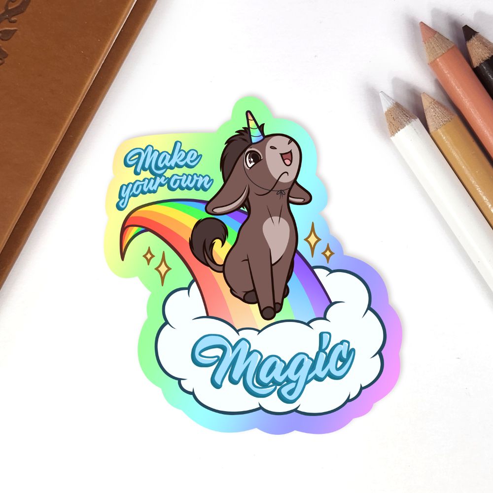 A fun sticker of a donkey sliding down a rainbow, text "Make your own Magic"