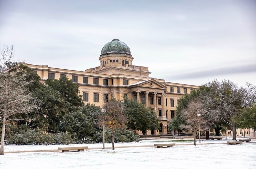 A snow covered academic building 