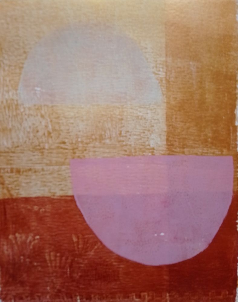 Cream coloured semicircle offset over pink semicircle on gold and bronze background.