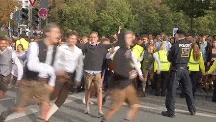 Eager crowd rushing to something awesome.