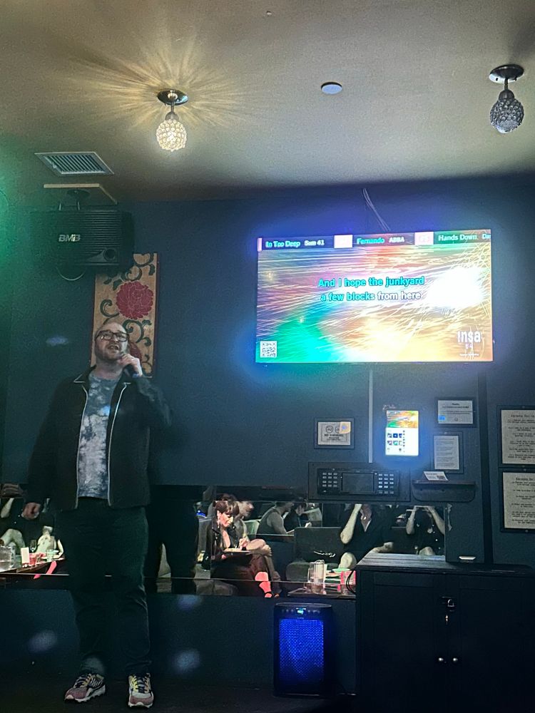 Josh singing “no children” at karaoke 