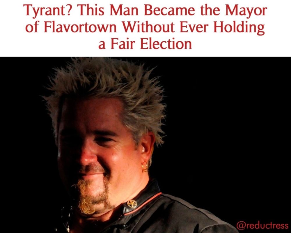 a closeup photo of guy fieri in creepy half-shaded lighting, with text in the style of a reductress shitpoast reading: “Tyrant? This Man Became the Mayor of Flavortown Without Ever Holding a Fair Election”