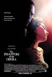 the phantom of the opera (2004) poster, a man with a mask covering his face, behind a woman, his hand is on her hands