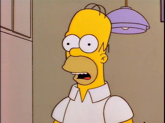 Homer Simpson, smiling politely. 