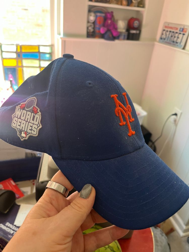 A Mets hat with a World Series patch 