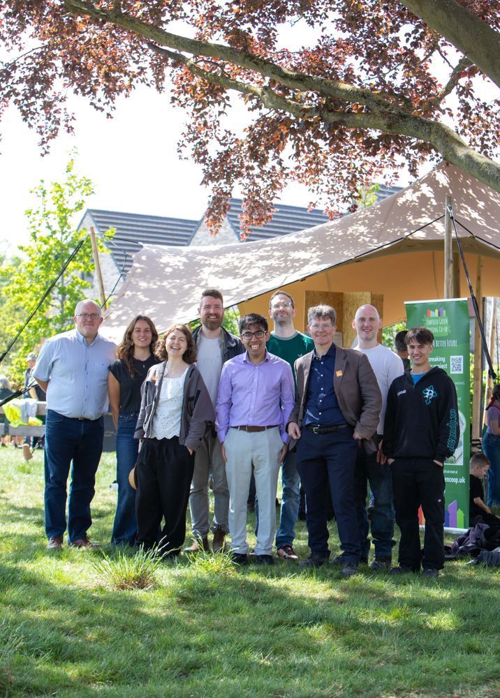 Yorspace board members stand infront of a tent and under a tree
