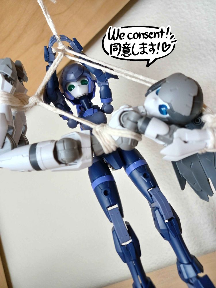 a white and grey acerby model is in rope shibari, suspended from above. a second, blue acerby adjusts the rope. a speech bubble reads "we consent!"
