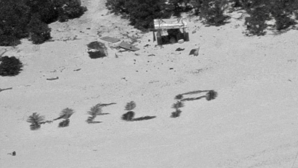 Castaways rescued after writing ‘HELP’ with palm leaves on remote island