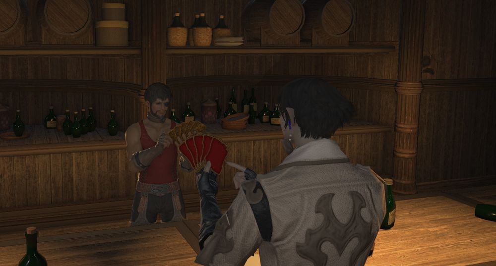 Phio and Buscarron on either side of the bar playing triple triad