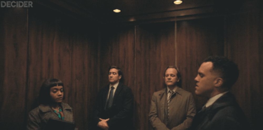 a group of people in an elevator with the word decider on the bottom left