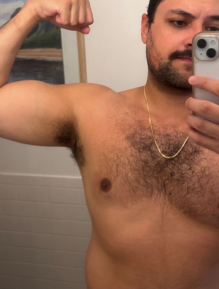 Post-shower selfie, no shirt, bicep flexed