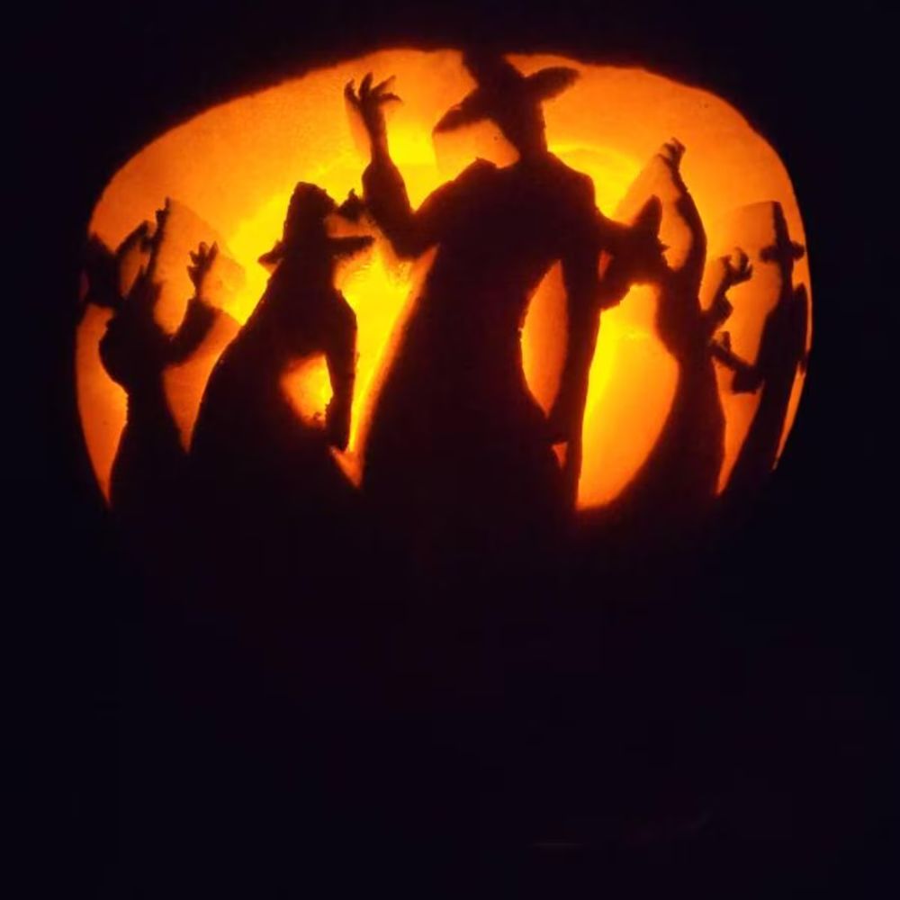 Jack o lanterns, carved pumpkins with silhouettes of the Saja Boys. 