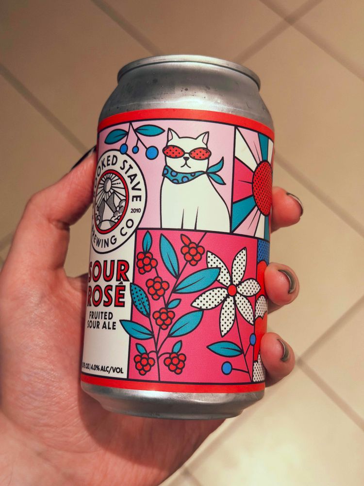 A can of beer fearing artwork of a white cat with pink sunglasses and a blue scarf 