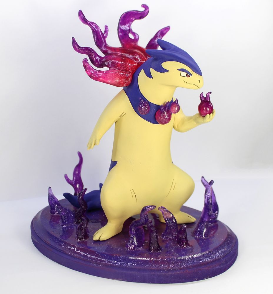 A sculpture of the pokemon hisuian typhlosion.  It has translucent purple flames around its nape and a collar with three smaller flames.  It holds a flame in its hand, looking poised to defend.  It stands atop a base of purple flames.