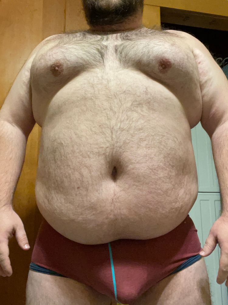 Me standing in only red boxer briefs with prominent bulge 