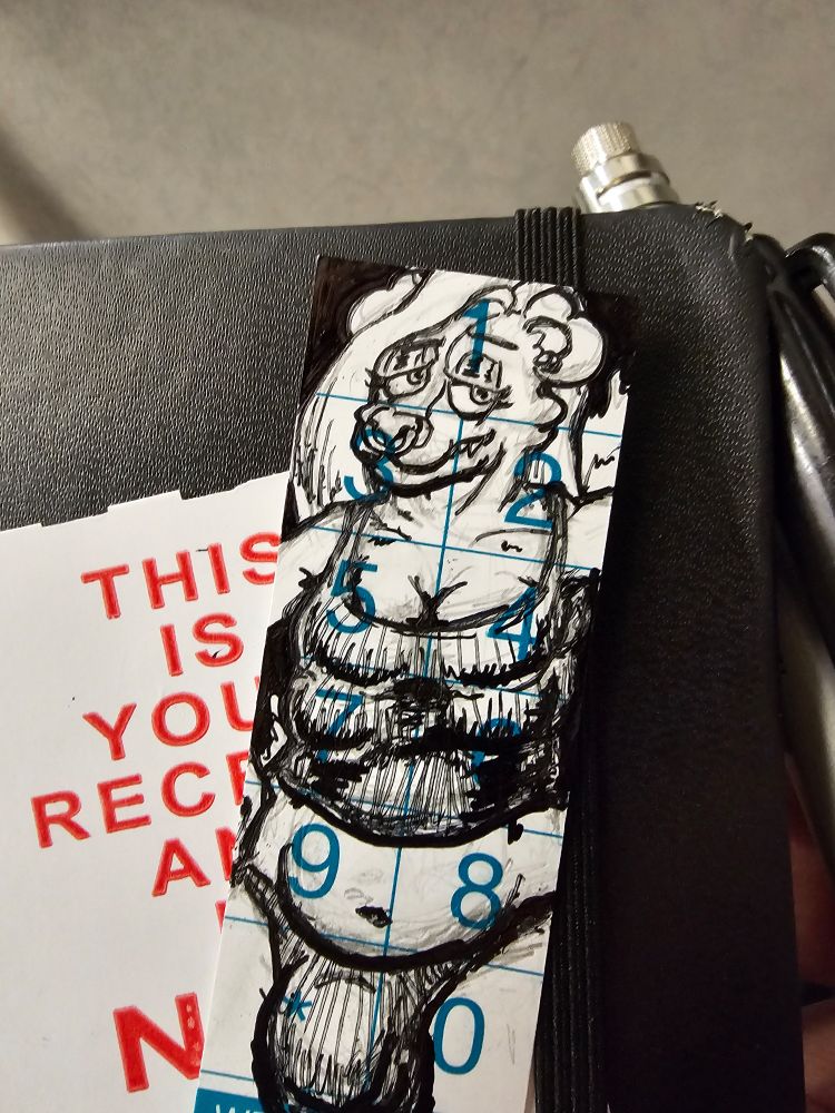 A risque pen doodle of Macroura drawn on one of those clicker sheets that trains use to show that you paid. It is a closer shot of the previous image, allowing you to see some more details (and flaws)