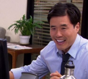 A man in a blue shirt and tie