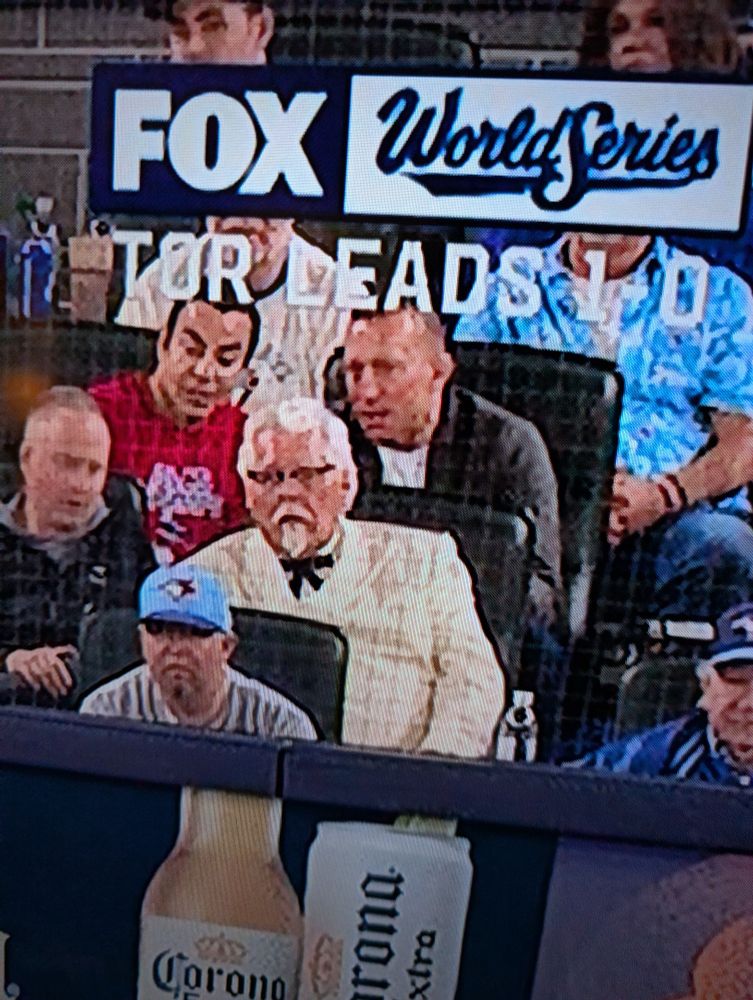 Col sanders in the stands at the World Series game