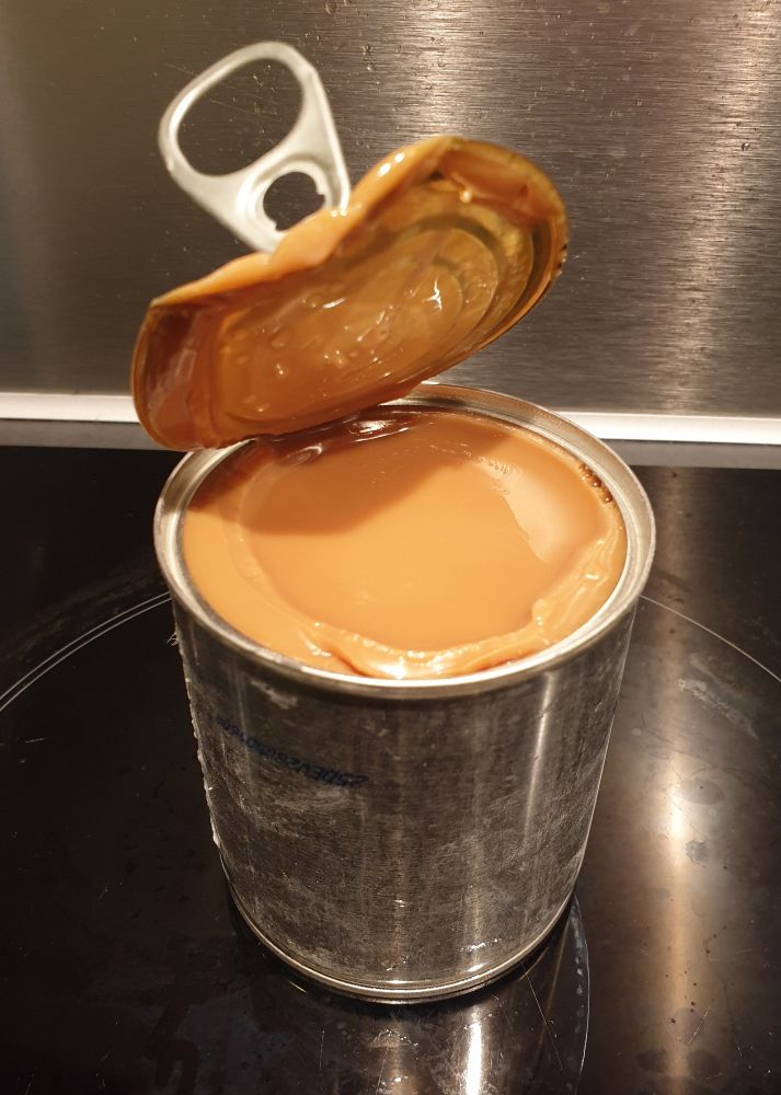 An open can of perfect dulce leche.