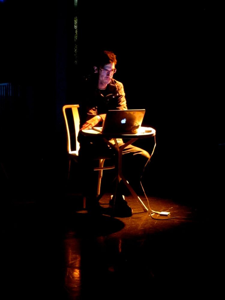 Luke Fraser playing live in a dark room