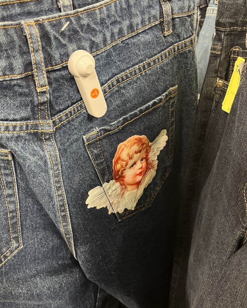Jeans with a cherub on the back pocket.