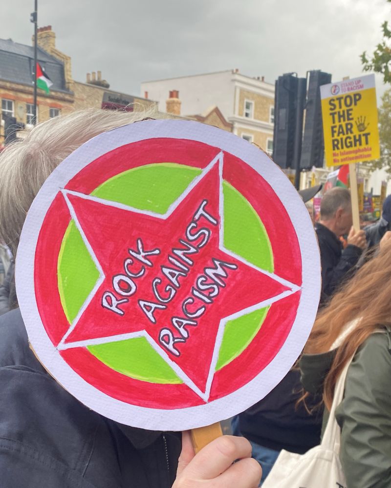 A star sign that says “rock again racism”