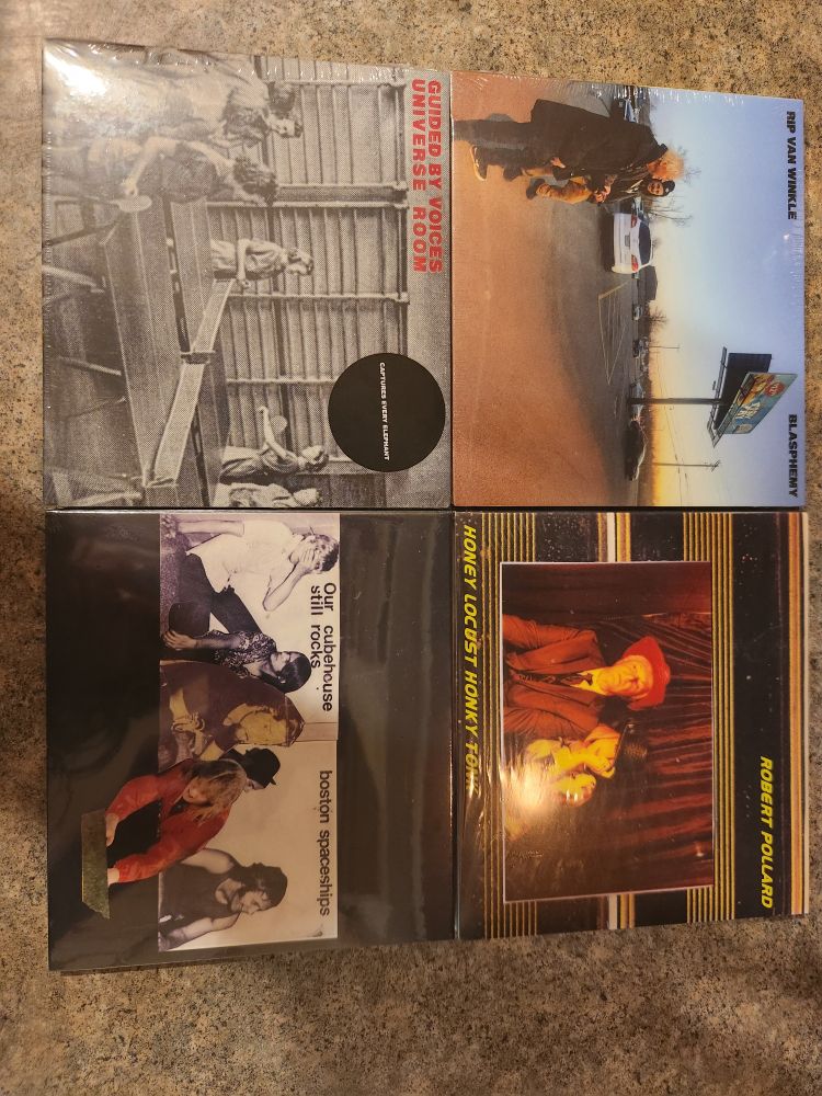 4 cds under 4 different artist names,  all songs by Robert Pollard. My life is exciting. 