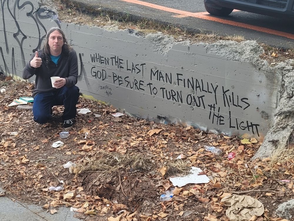 Graffiti reading "When the last man finally kills god be sure to turn out the light".