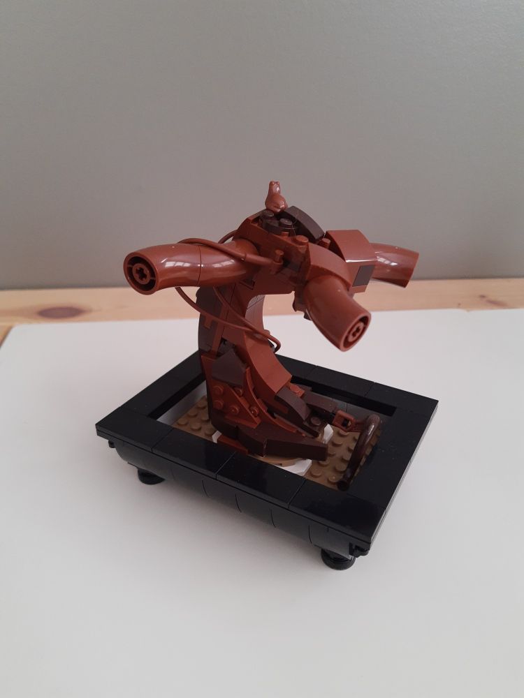 A leafless, unfinished LEGO Botanical Collection Bonsai Tree model.