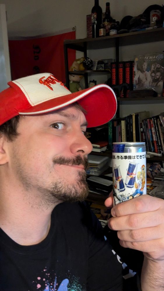 Picture of me holding a can of redbull with terry bogard and Rock howard on it