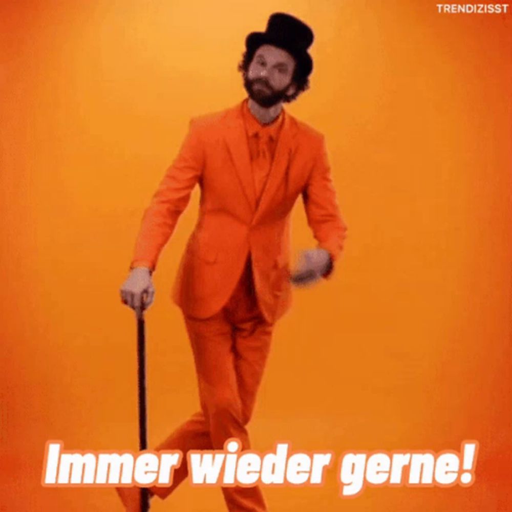 a man in an orange suit and top hat dancing with the words immer wieder gerne written below him