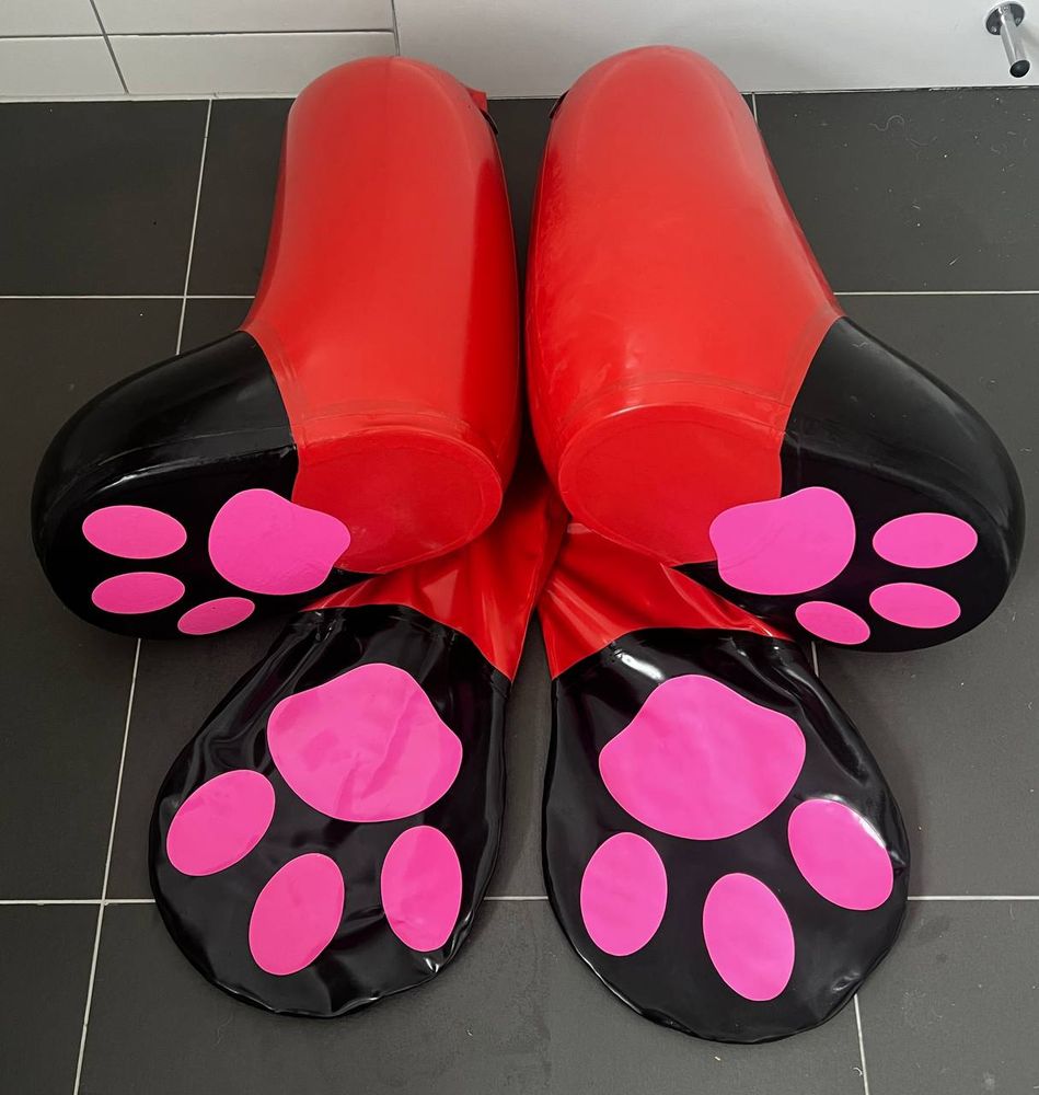 Red and black inflatable paws.