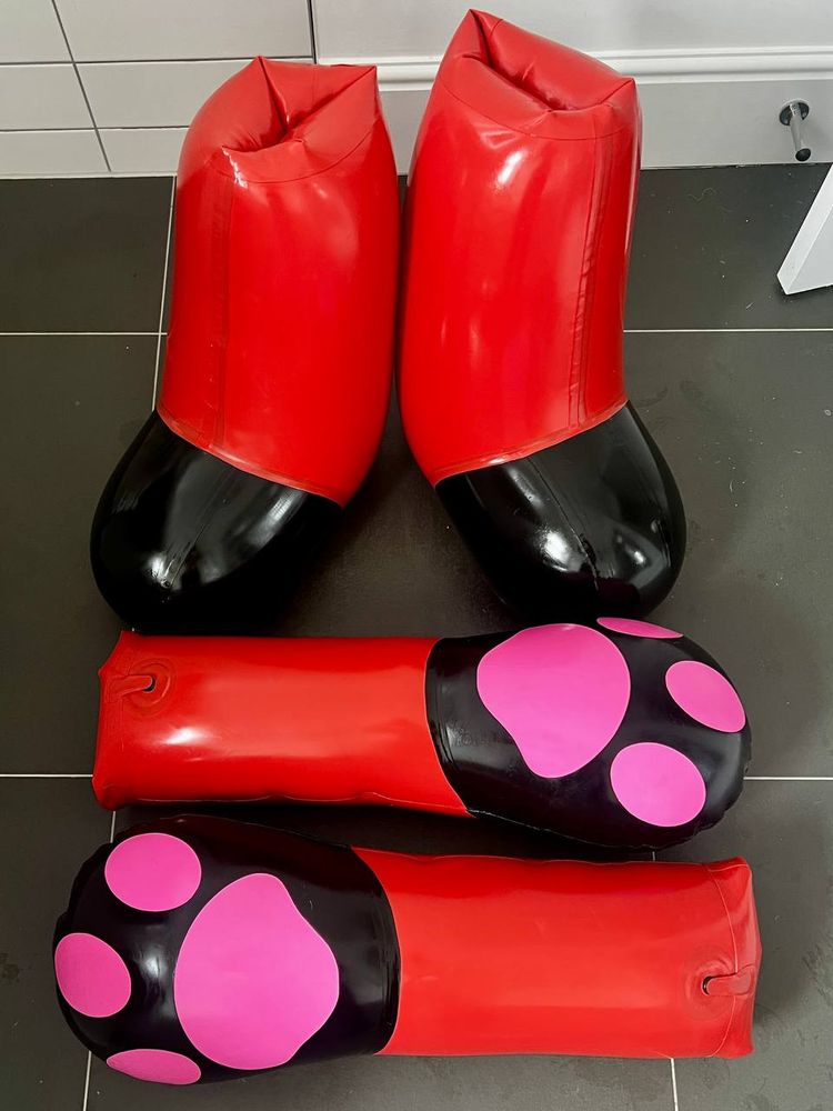 Red and black inflatable paws.