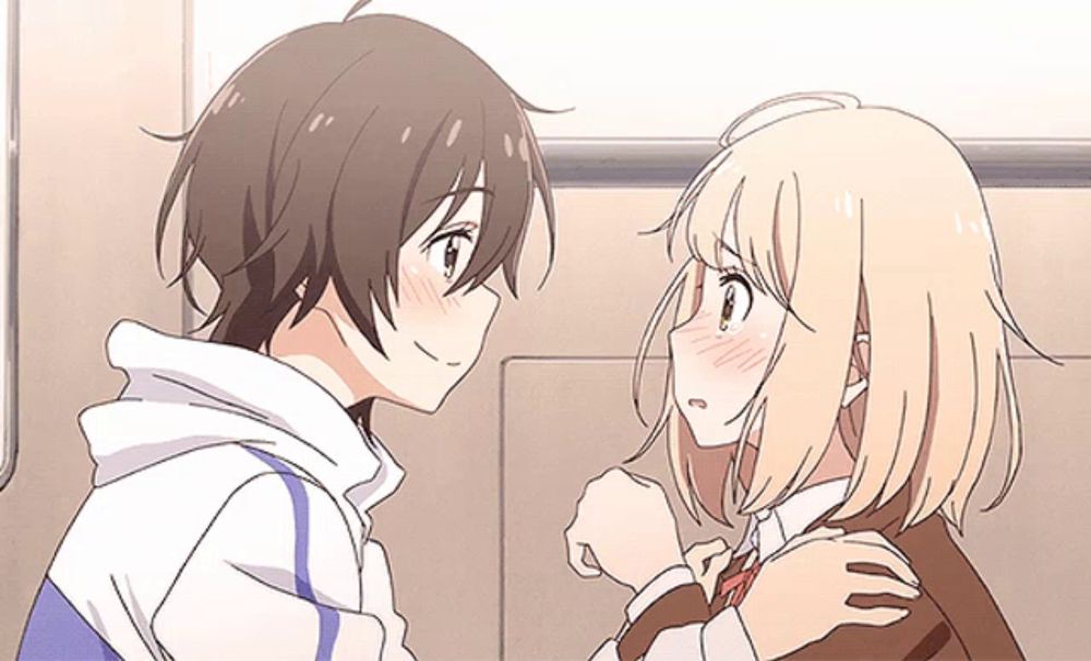 a boy and a girl are looking at each other with their eyes closed