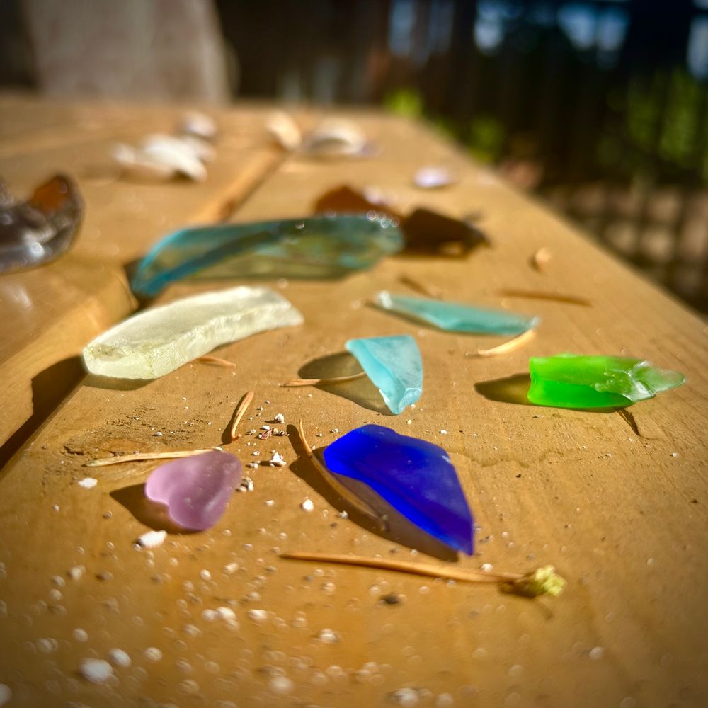 Colourful beach glass on a table outdoors