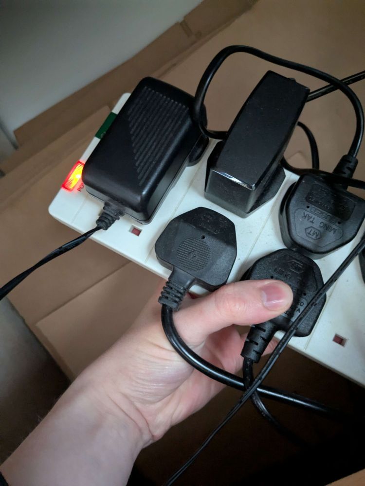 Picture of a extension lead with one of the plugs covering another socket