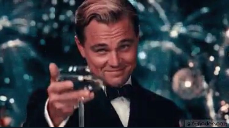 Leonardo di caprio raising a glass