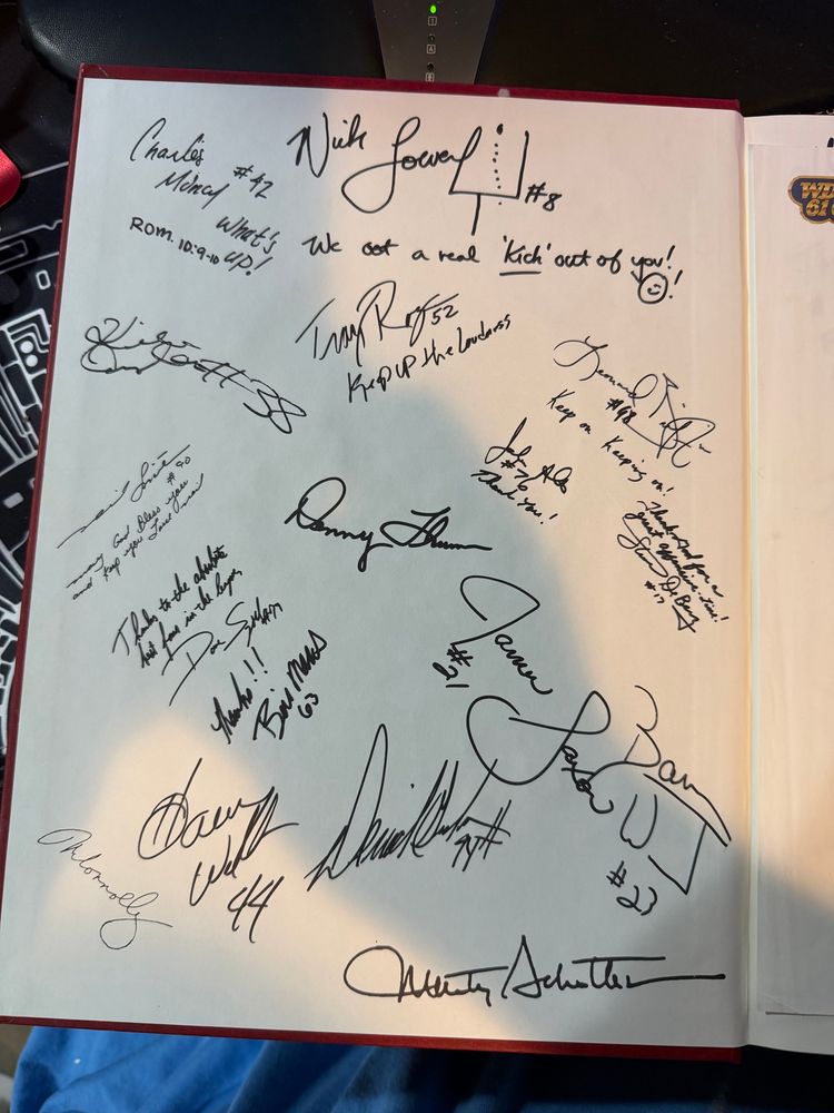 A bunch of signatures.  Nick Lowery, Marty Schottenheimer, Bill Maas, Neil Smith, John Alt, Steve DeBerg, Kimble Anders