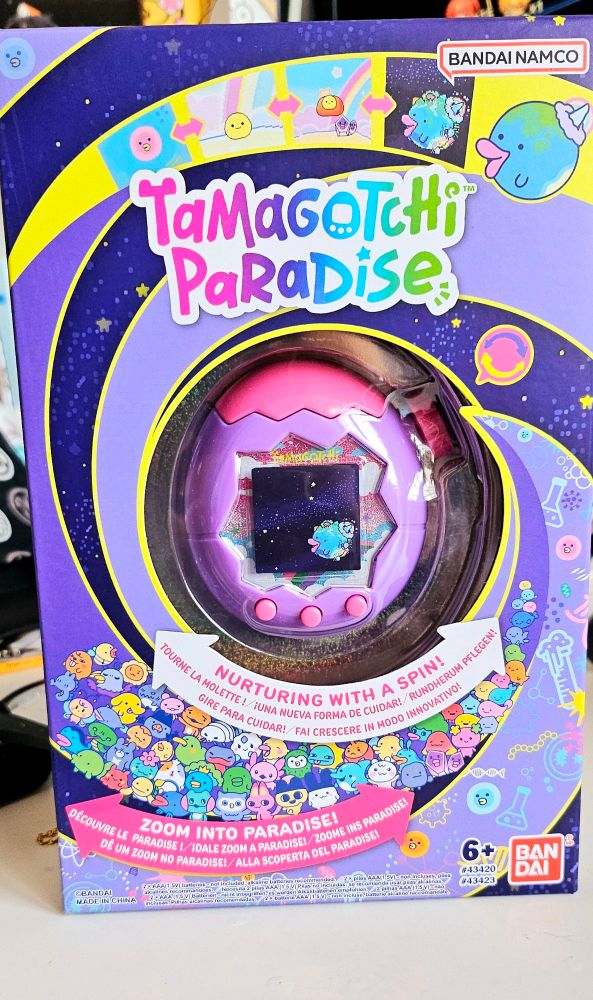 A purple and pink tamagotchi paradise still in its box