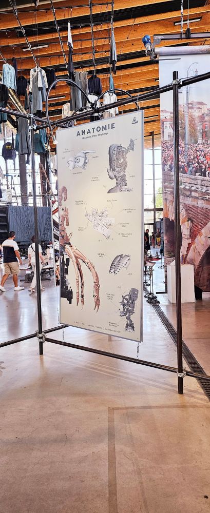 A panel with sketches and process of one of the animatronic