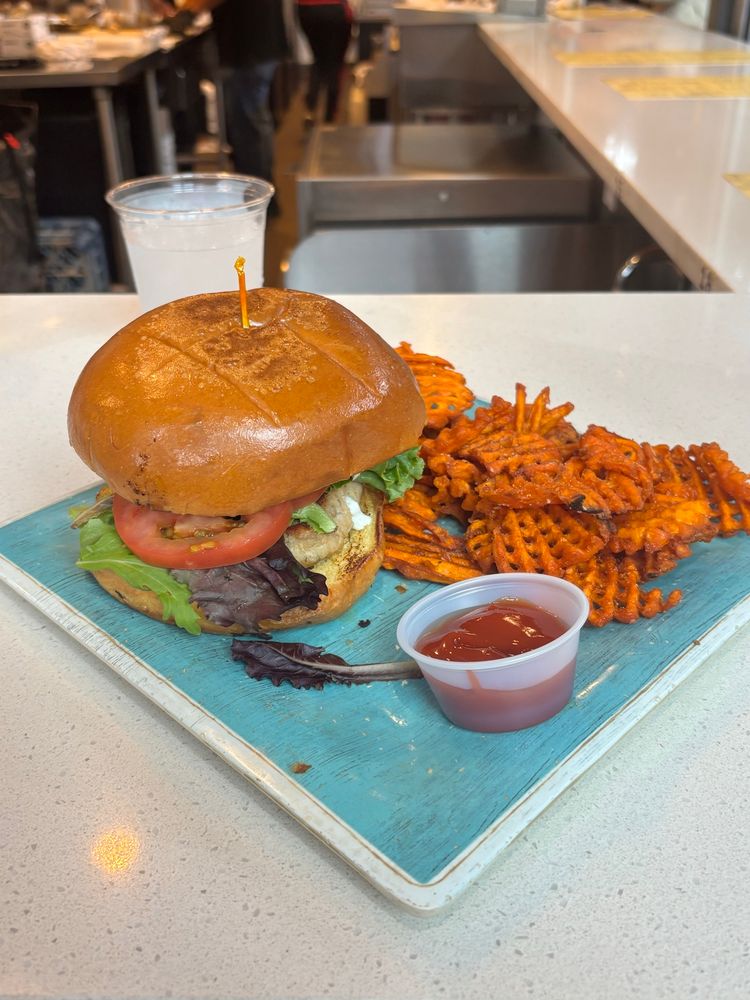 Salmon burger with sweet potato waffle fries
